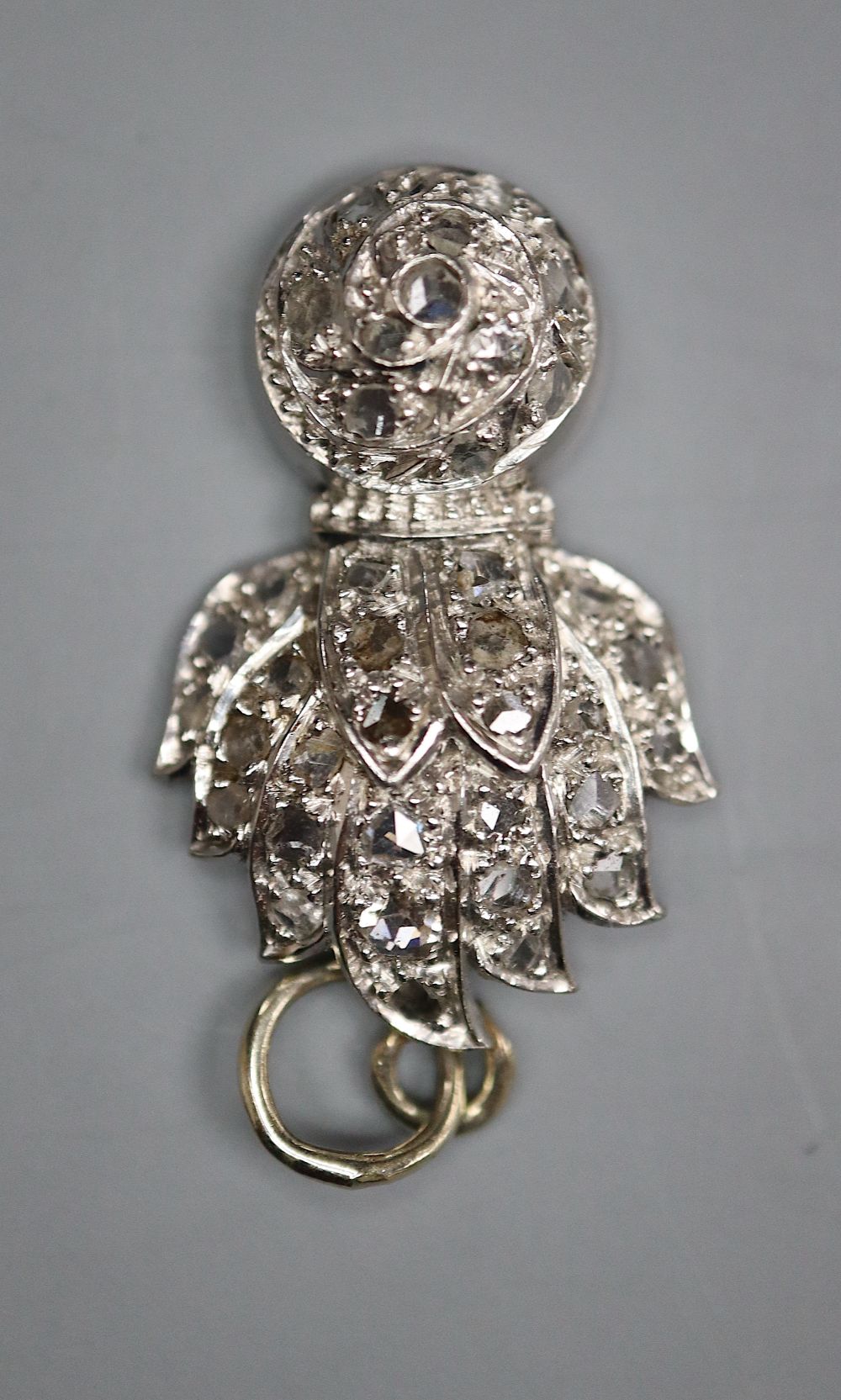 An early 20th century white metal and rose cut diamond set Royal Fusiliers pendant, 26mm, gross 4.7 grams.